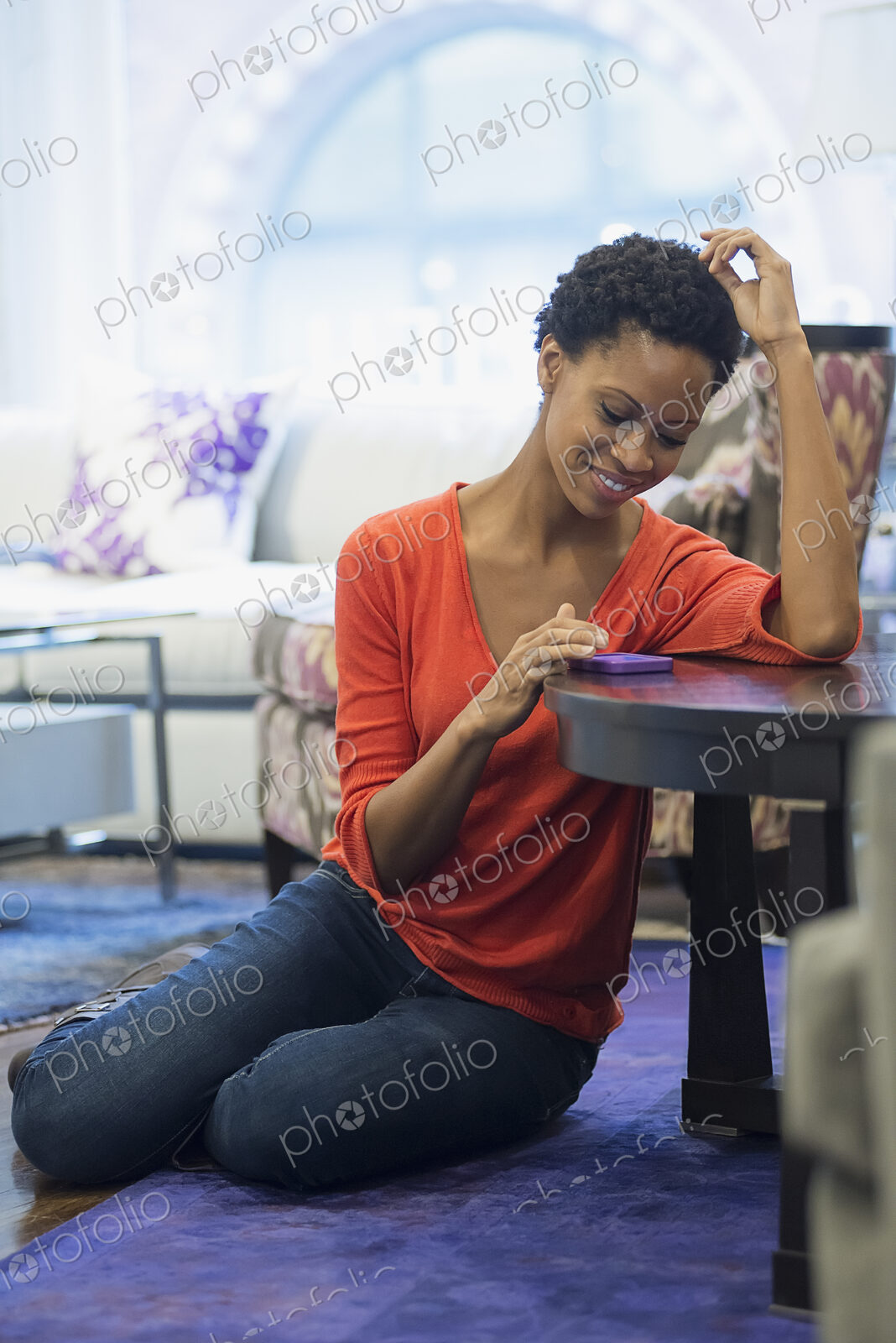 Woman relaxing at home using smartphone
