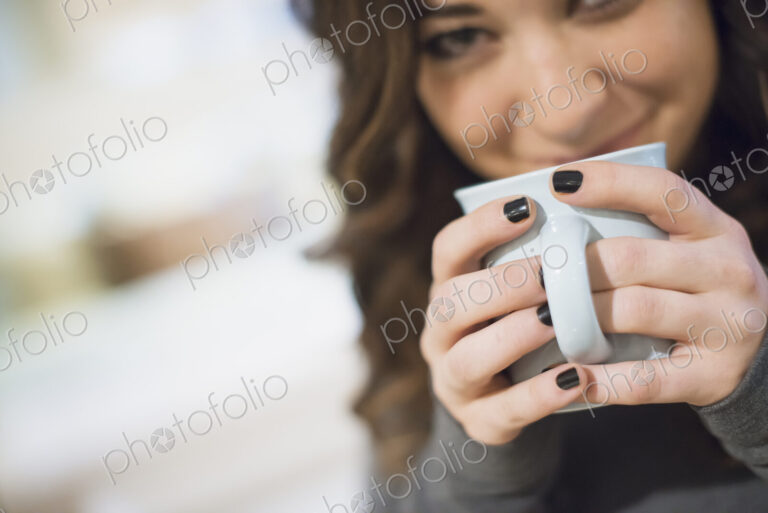 Woman relaxing at home with coffee