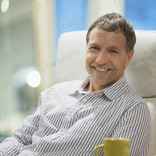 Woman relaxing at home with coffee