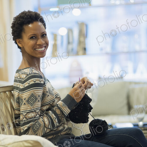 Woman relaxing at home with knitting Woman relaxing at home with knitting