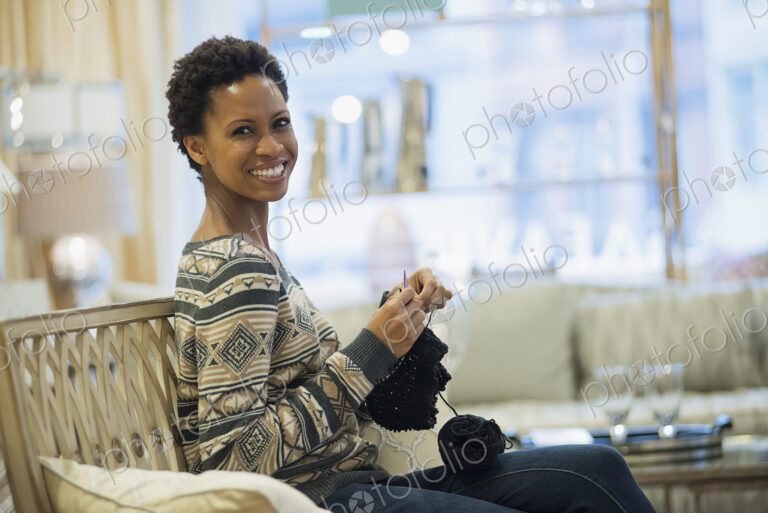 Woman relaxing at home with knitting