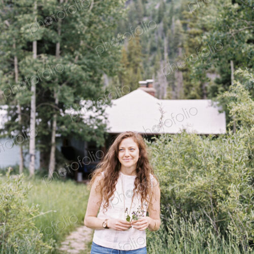 Woman walking along a footpath on a ranch. Woman walking along a footpath on a ranch.
