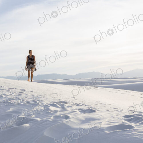 Woman walking in the dunes, White Sands Nat'l Monument, NM Woman walking in the dunes, White Sands Nat'l Monument, NM