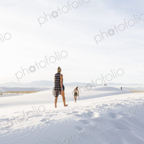 Woman walking in the dunes, White Sands Nat'l Monument, NM Woman walking in the dunes, White Sands Nat'l Monument, NM