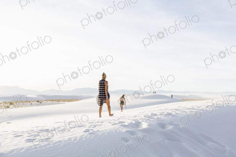 Woman walking in the dunes, White Sands Nat'l Monument, NM