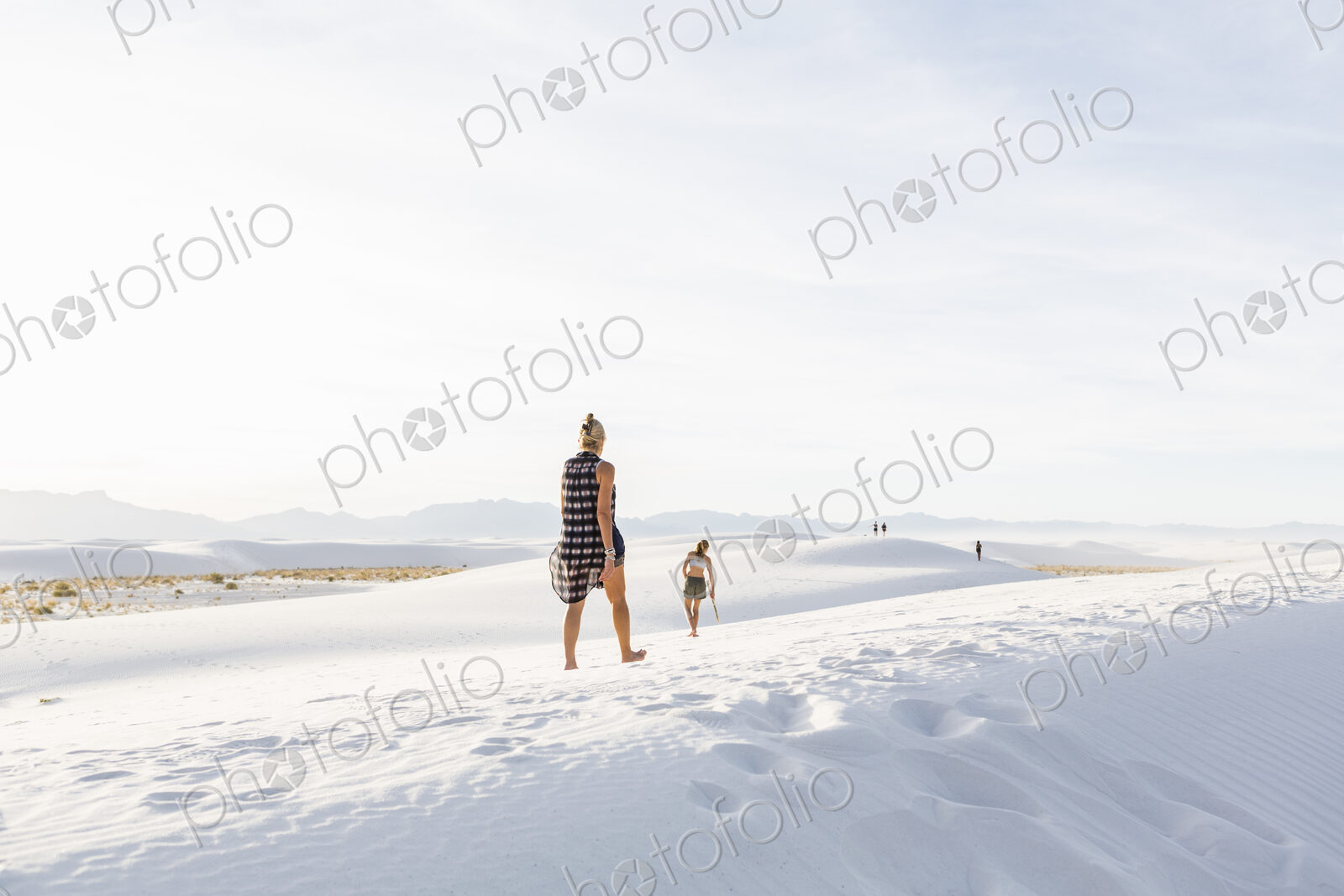 Woman walking in the dunes, White Sands Nat’l Monument, NM