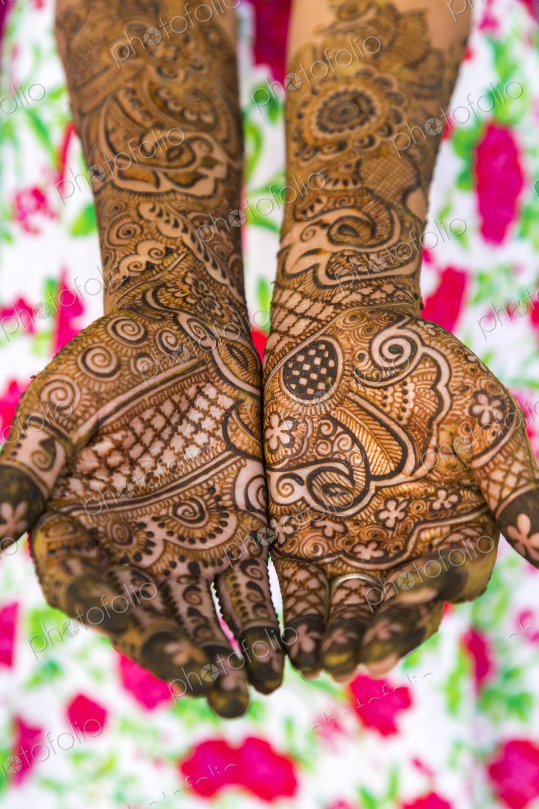 Woman’s hands covered in Henna tattoos