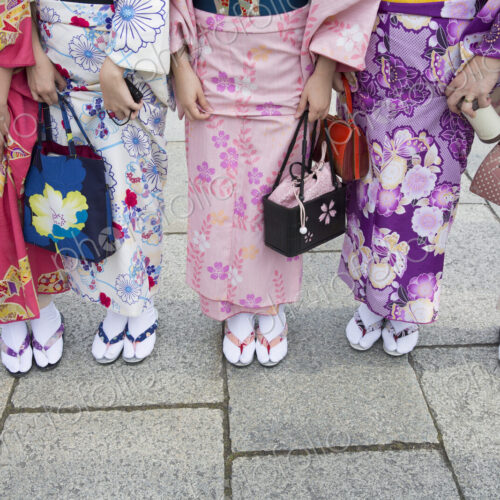 Women wearing traditional Japanese kimonos and footwear, low section Women wearing traditional Japanese kimonos and footwear, low section