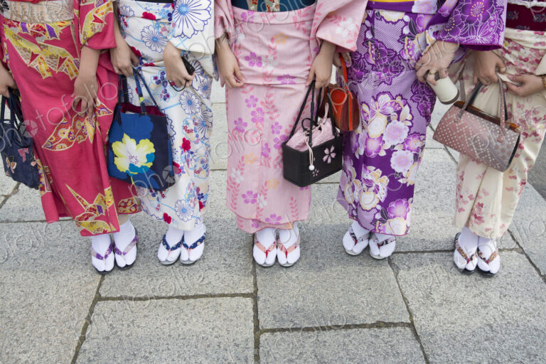 Women wearing traditional Japanese kimonos and footwear, low section