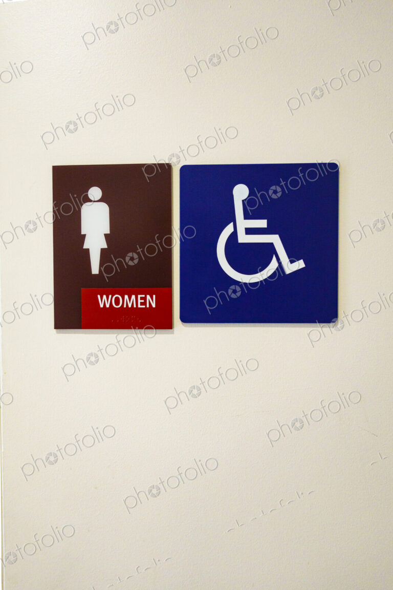 Women's room with ADA disabled person's access sign.