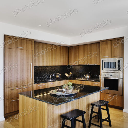 Wood cupboards in modern kitchen Wood cupboards in modern kitchen