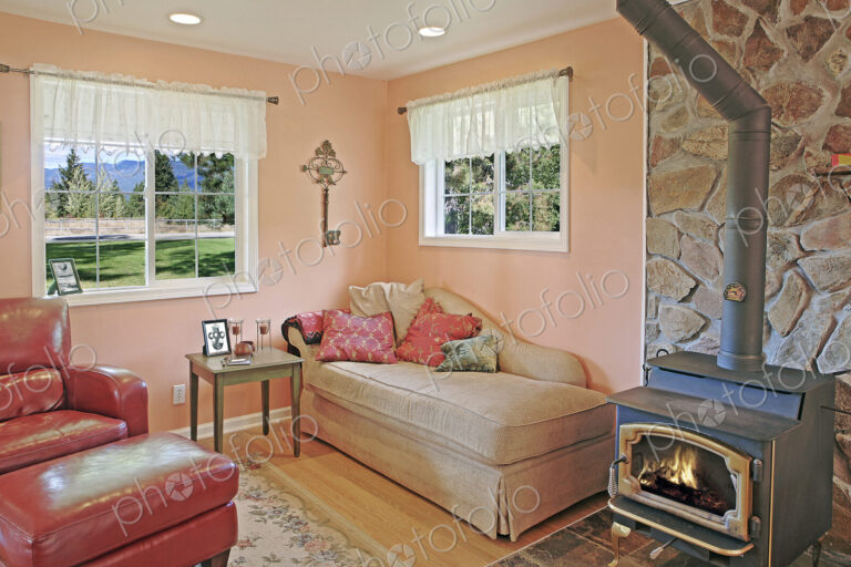 Wood stove and daybed in rustic living room