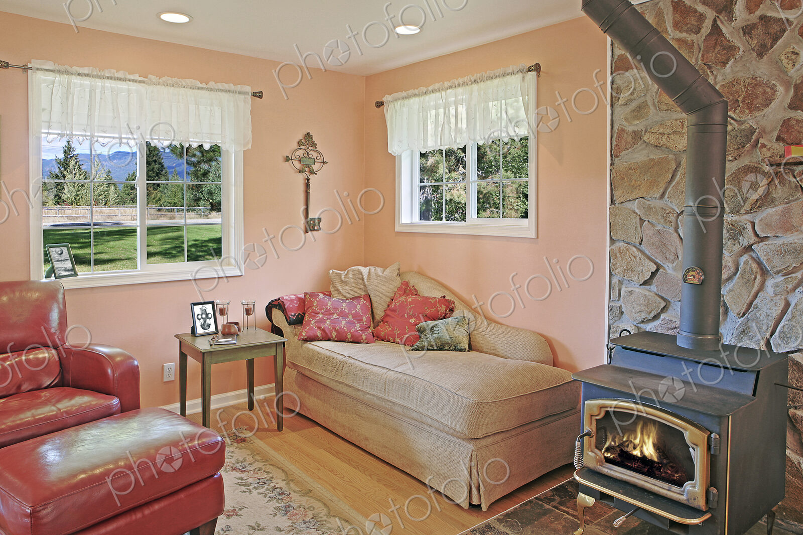 Wood stove and daybed in rustic living room