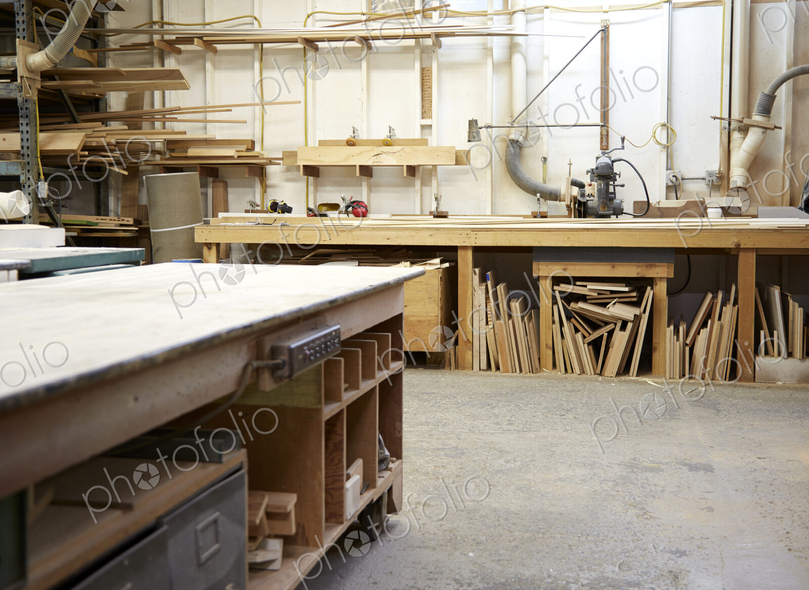 Wood, workbenches and tools in workshop