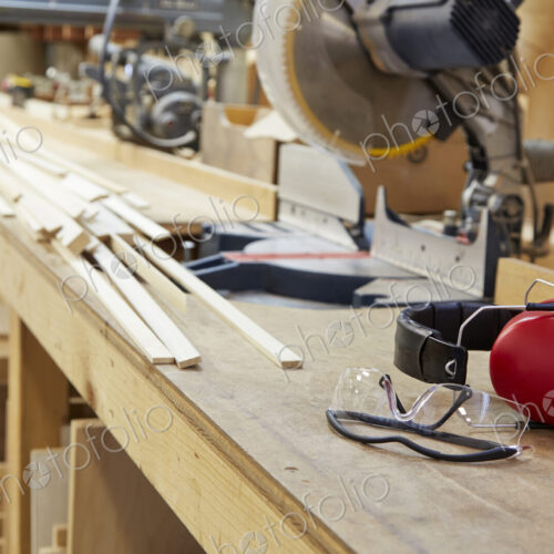 Wood, workbenches and tools in workshop Wood, workbenches and tools in workshop