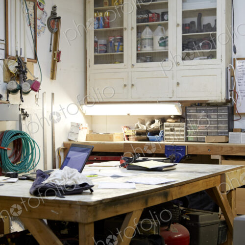 Wood, workbenches and tools in workshop Wood, workbenches and tools in workshop
