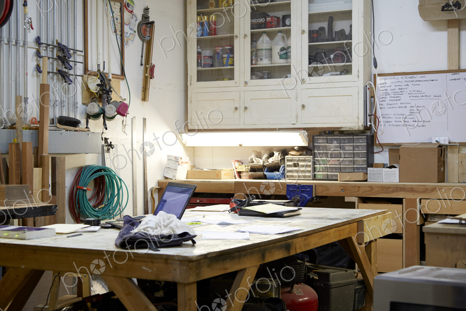 Wood, workbenches and tools in workshop