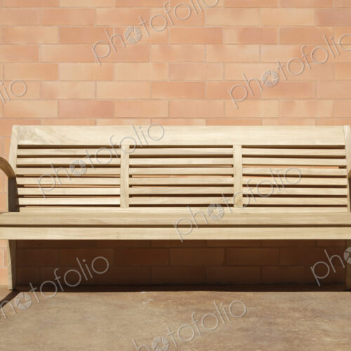 Wooden Bench Set Against Brick Wall Wooden Bench Set Against Brick Wall