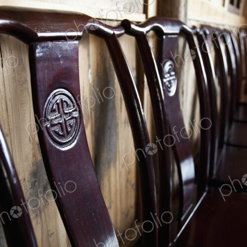 Wooden Chairs Against a Wall Wooden Chairs Against a Wall