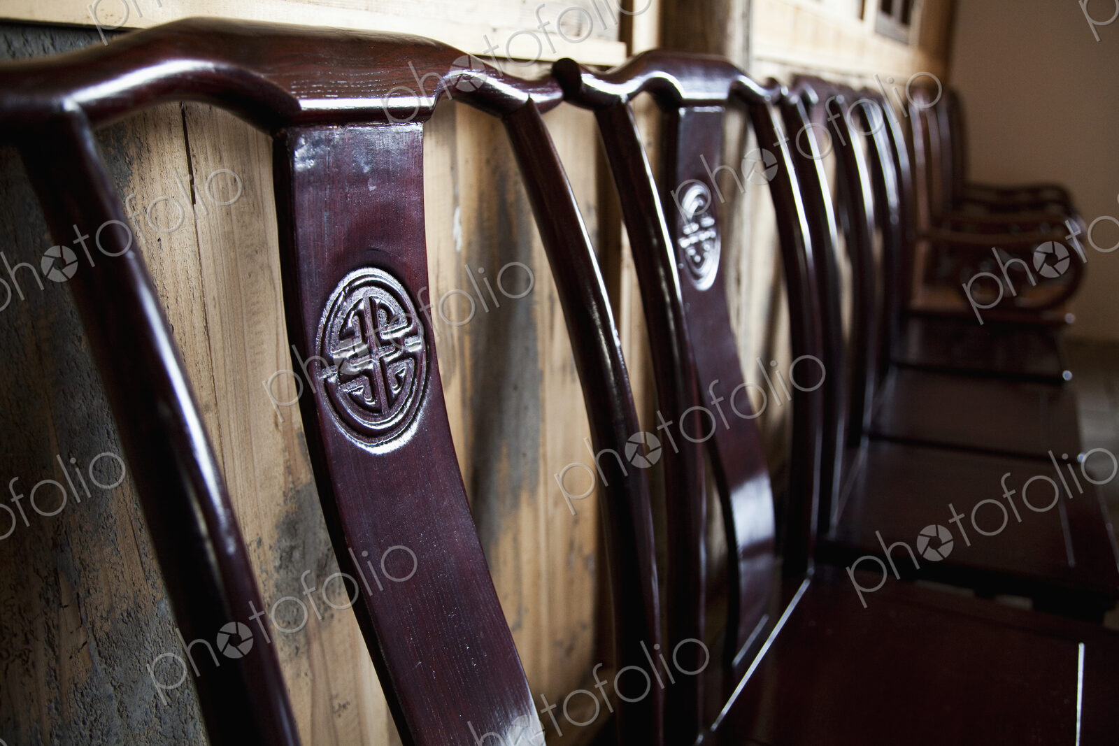 Wooden Chairs Against a Wall