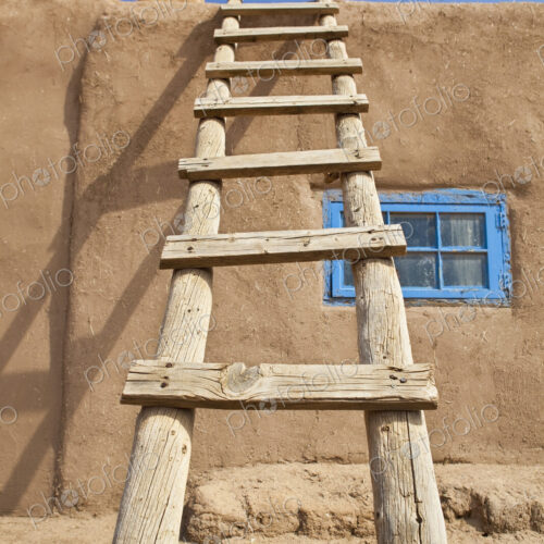Wooden Ladder Against an Adobe Building Wooden Ladder Against an Adobe Building