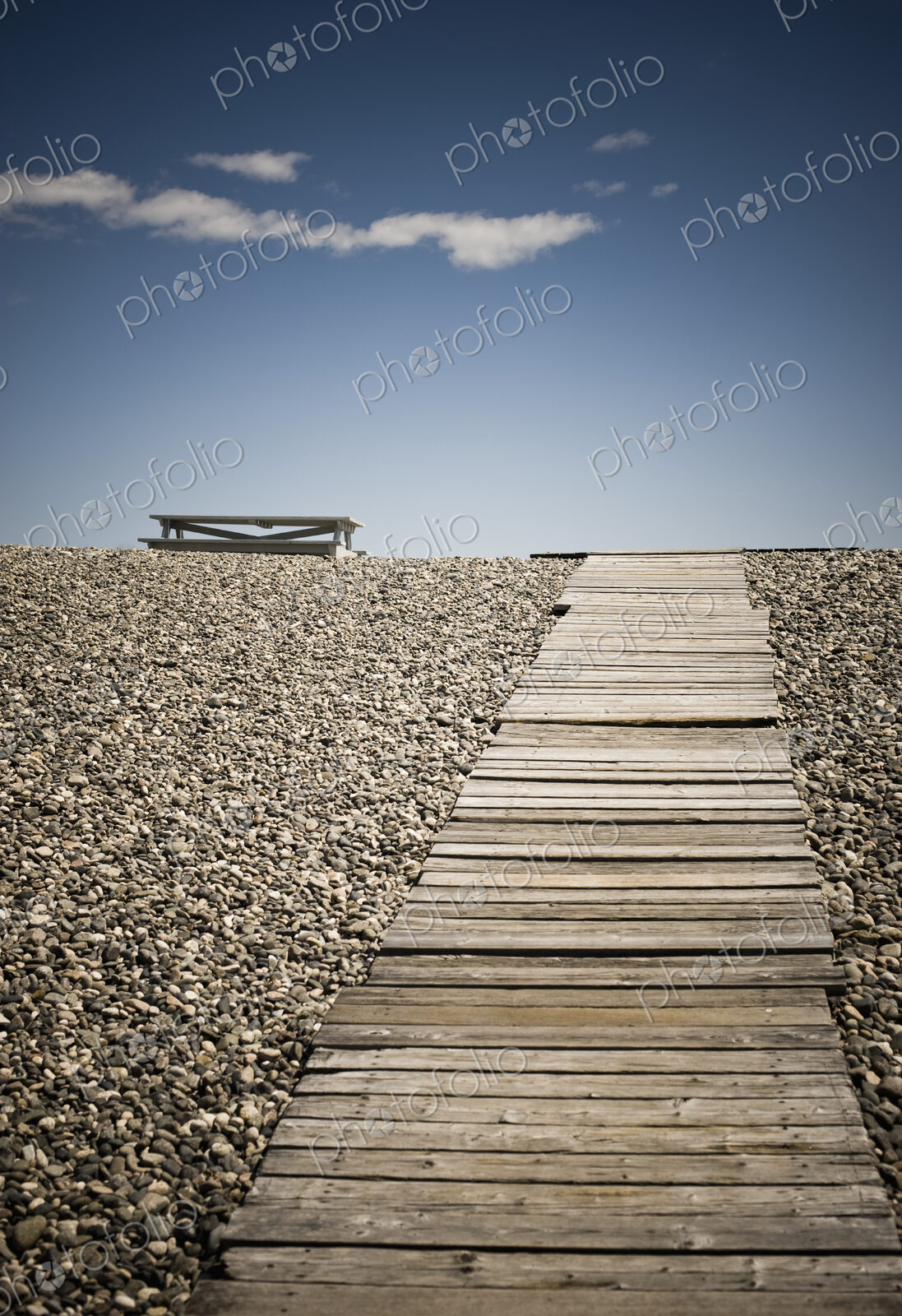 Wooden Walkway and Picnic Table at the Beach