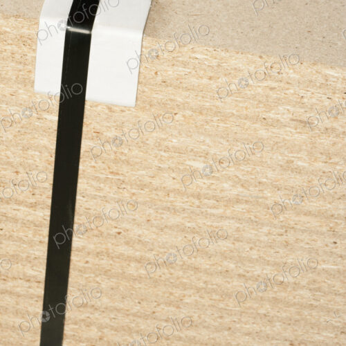 Wooden block with tape and bumper block to protect corner. Wooden block with tape and bumper block to protect corner.