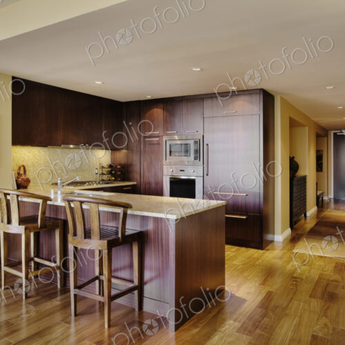 Wooden cupboards in modern kitchen