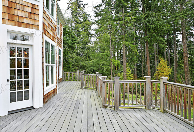 Wooden deck on house near forest