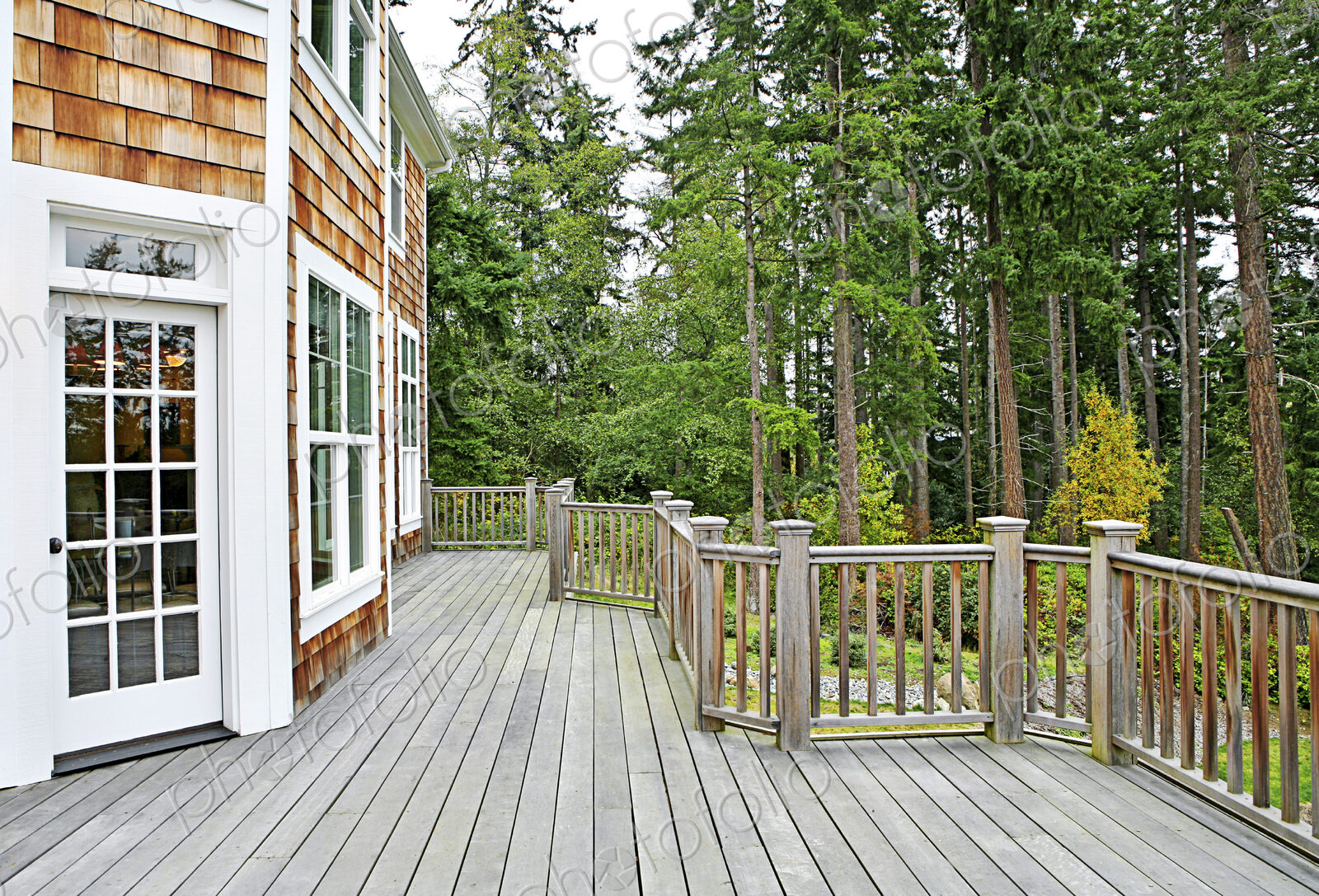 Wooden deck on house near forest