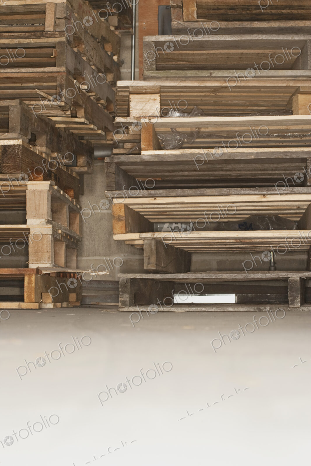 Wooden pallets piled up.