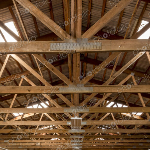 Wooden rafters in indoor horse riding ring Wooden rafters in indoor horse riding ring