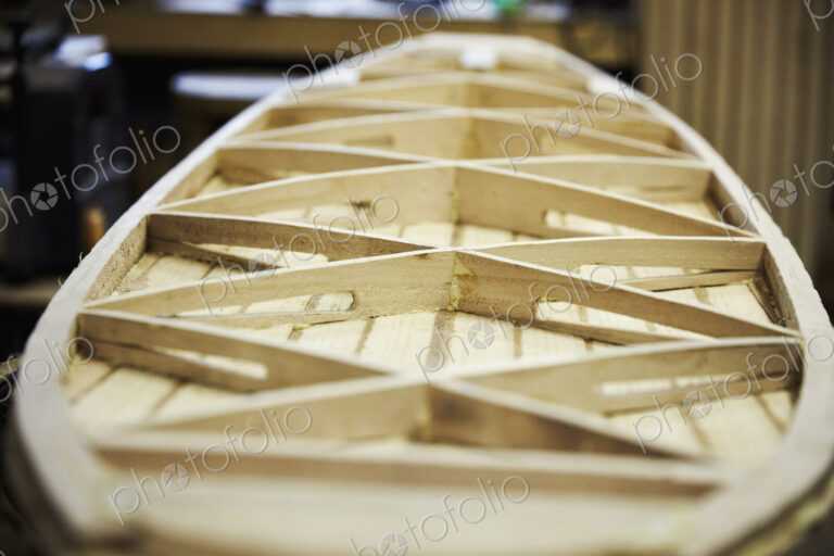 Wooden surfboard under construction, view of the interior struts.