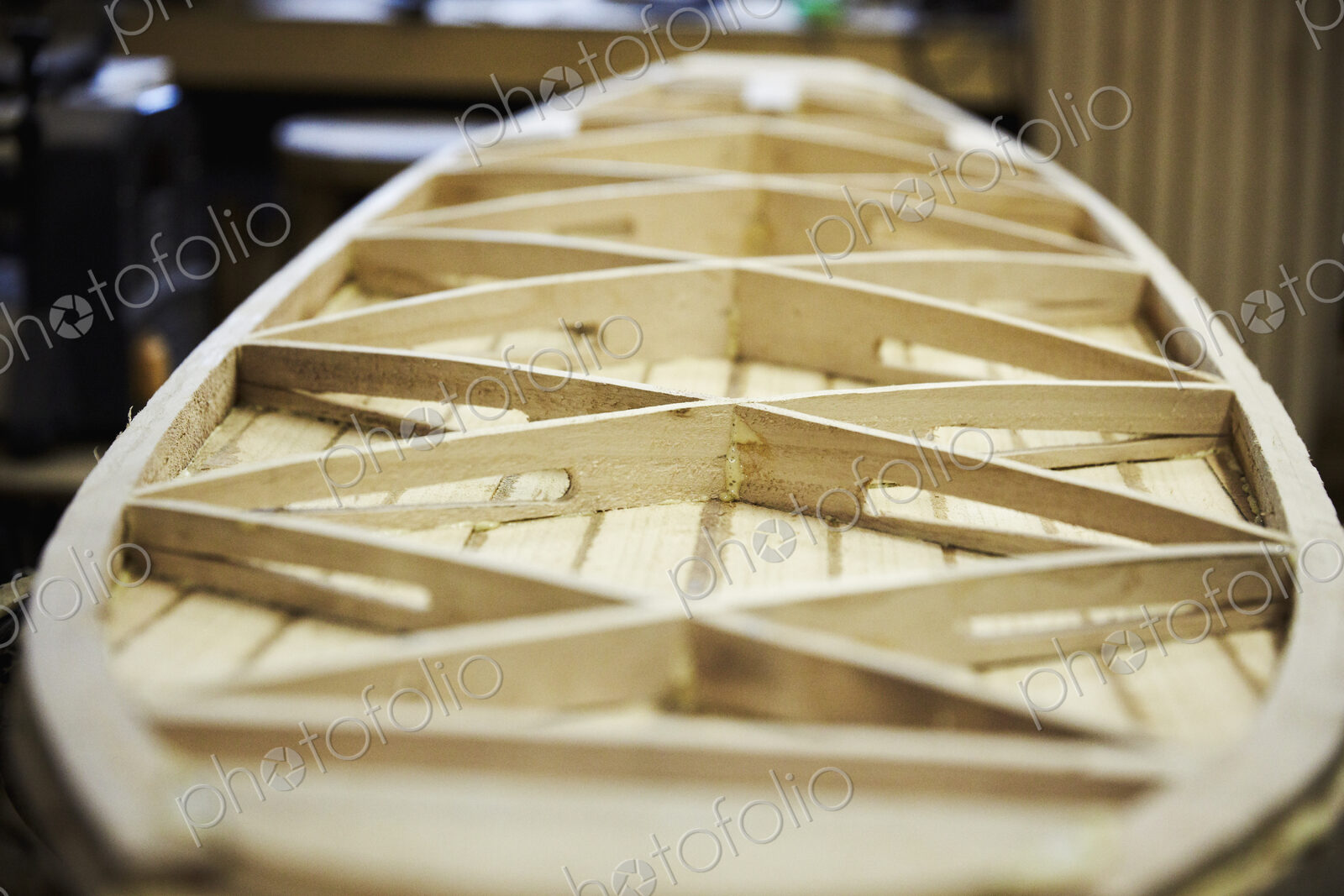 Wooden surfboard under construction, view of the interior struts.