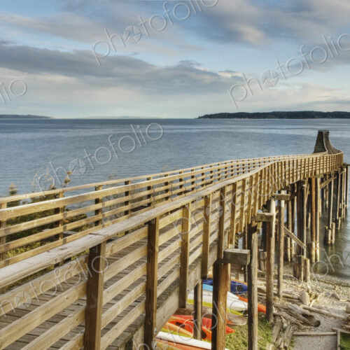 Wooden walkway on beach down to water. Wooden walkway on beach down to water.