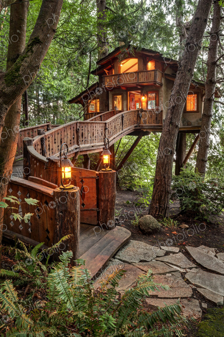 Wooden walkway to illuminated tree house