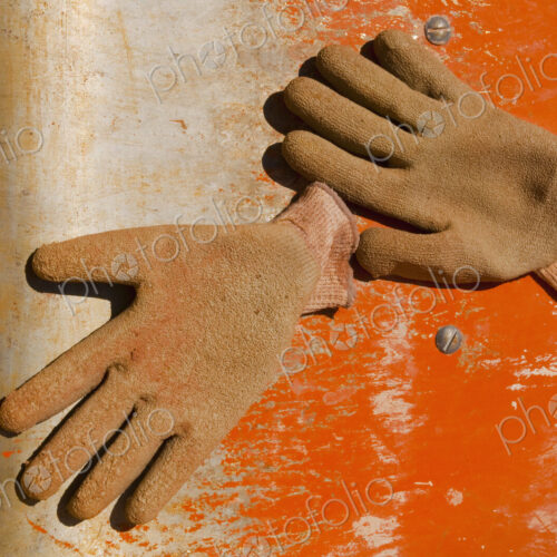 Work Gloves on Metal Surface Work Gloves on Metal Surface