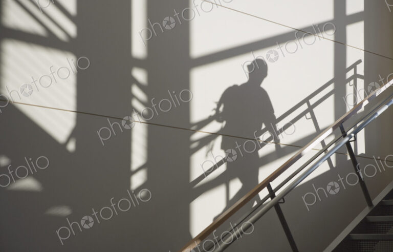 Workers Shadow in a Stairwell