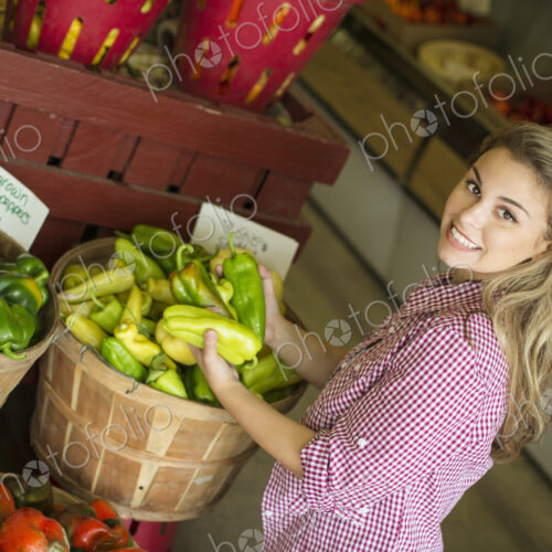 Working on an organic farm. A young blonde haired woman sorting different types of… Working on an organic farm. A young blonde haired woman sorting different types of…