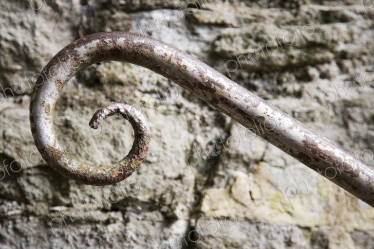 Wrought Iron Spiral and Stone Wall