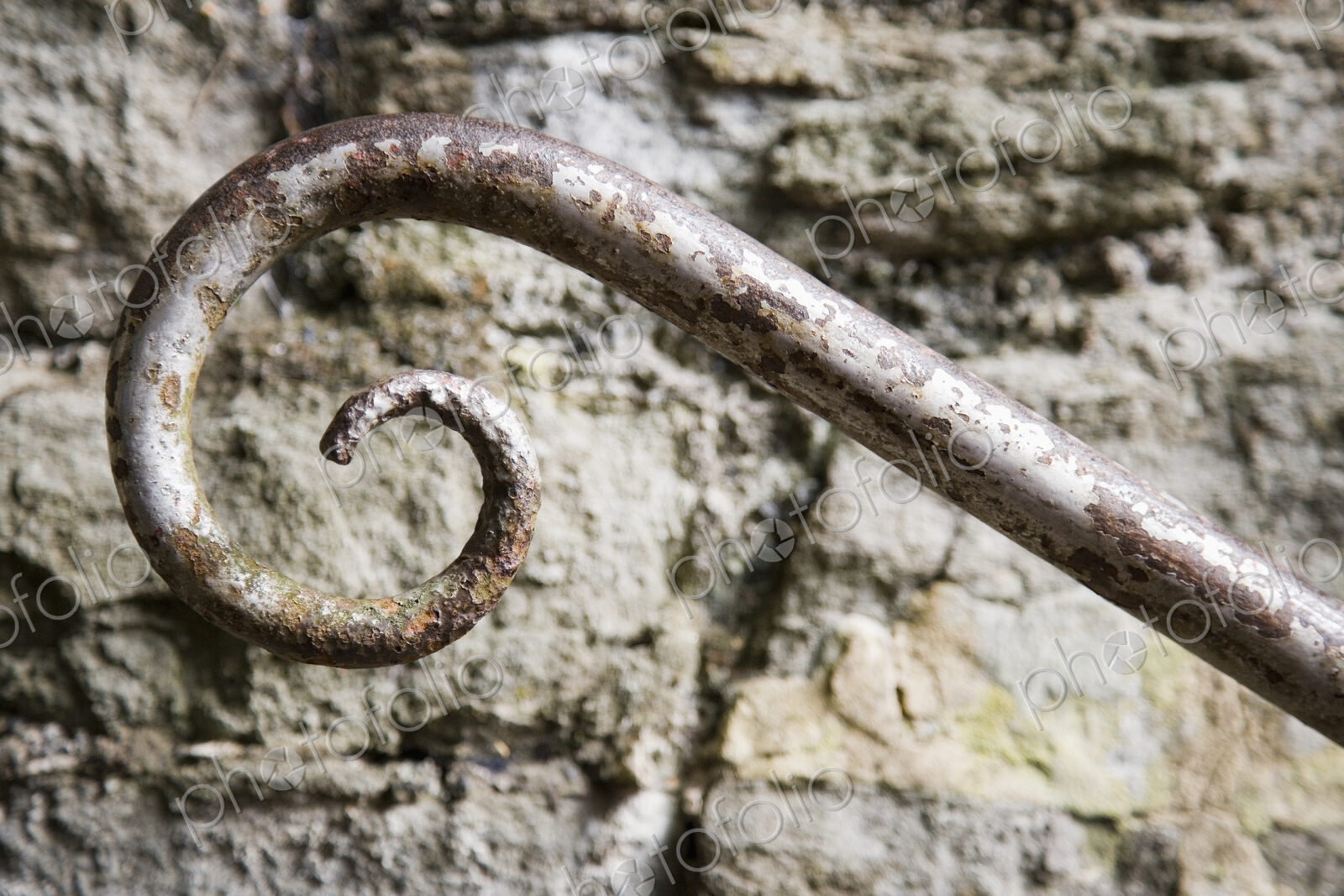 Wrought Iron Spiral and Stone Wall