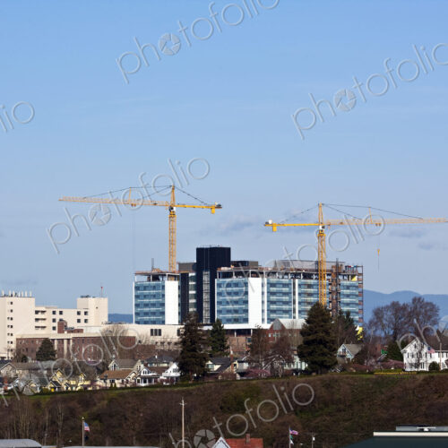 Yellow Tower Cranes at a Construction Site Yellow Tower Cranes at a Construction Site