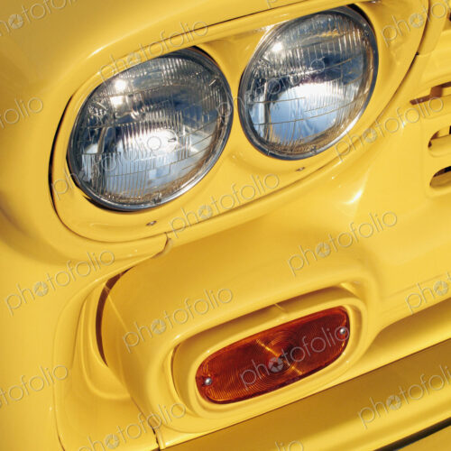 Yellow bodywork and vehicle lights on a school bus Yellow bodywork and vehicle lights on a school bus