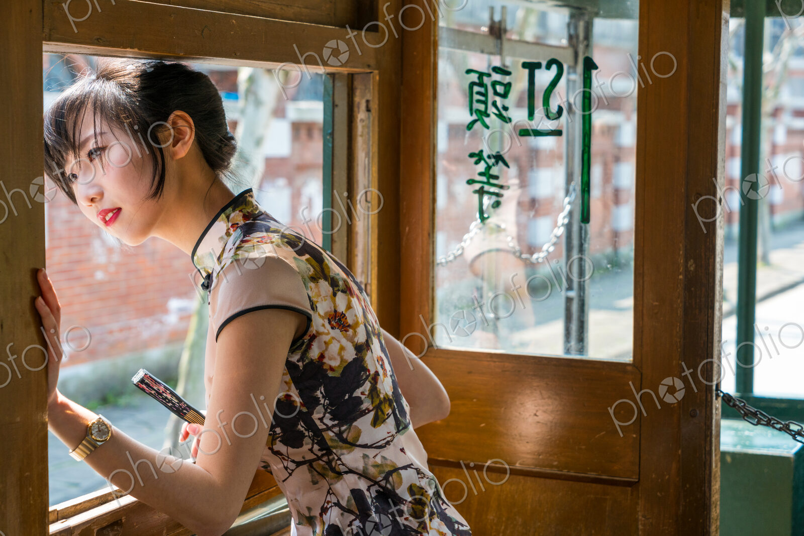 Young Chinese Woman in old tram, Shanghai, China