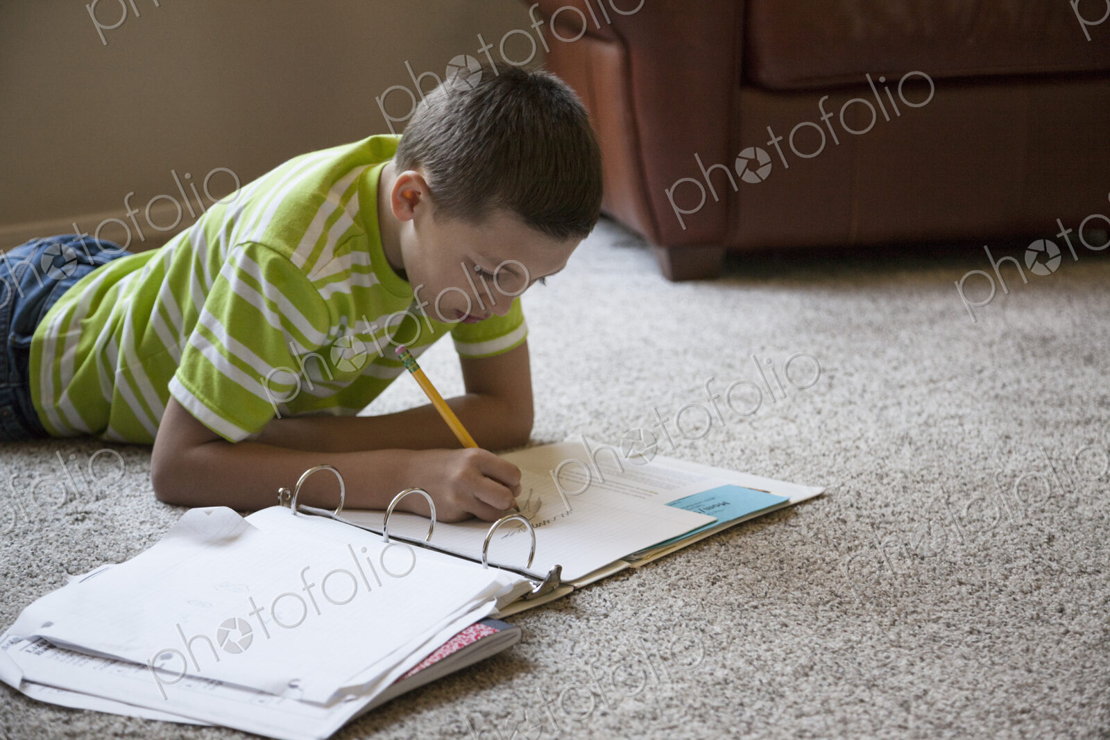 Young boy at home doing homework.