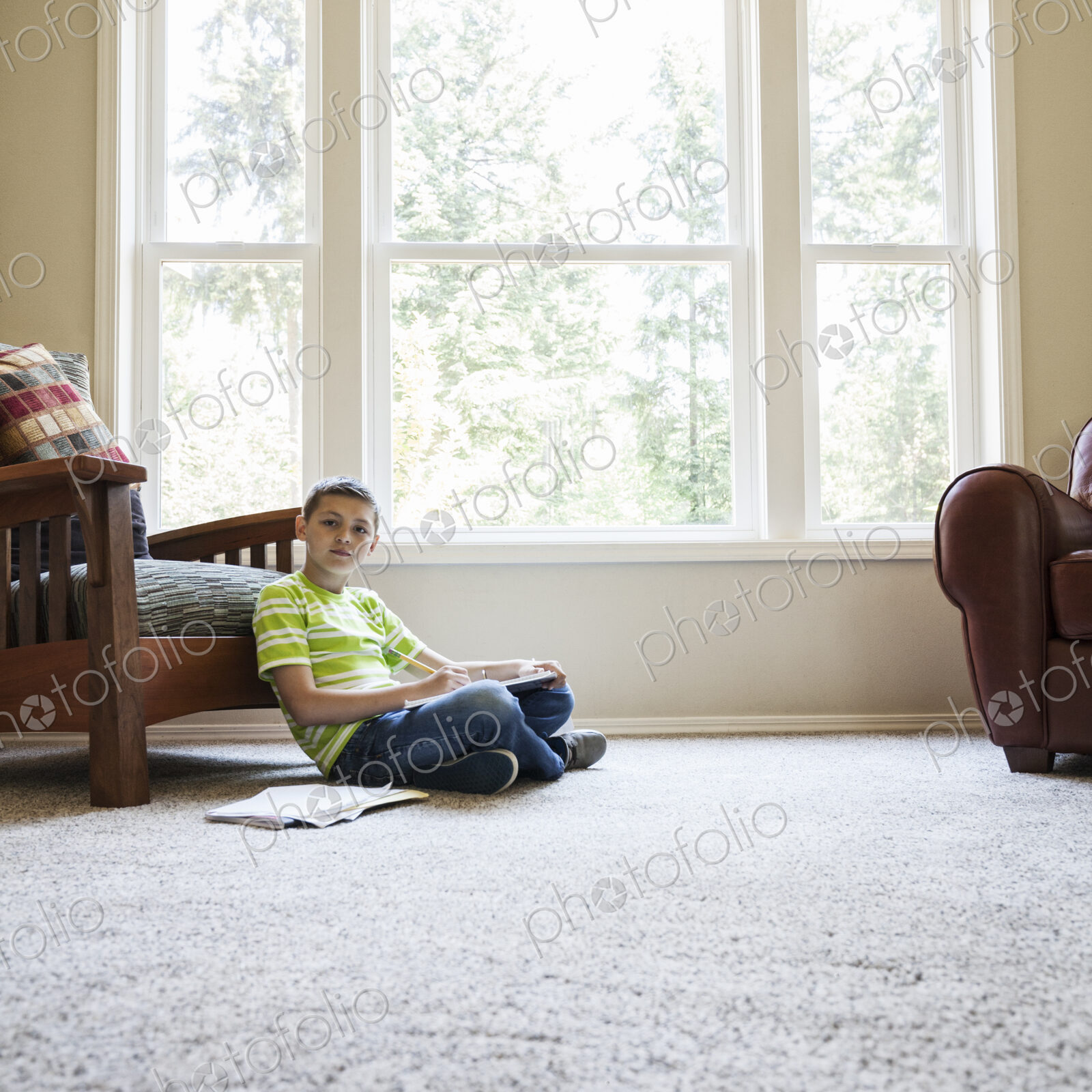 Young boy at home doing homework.