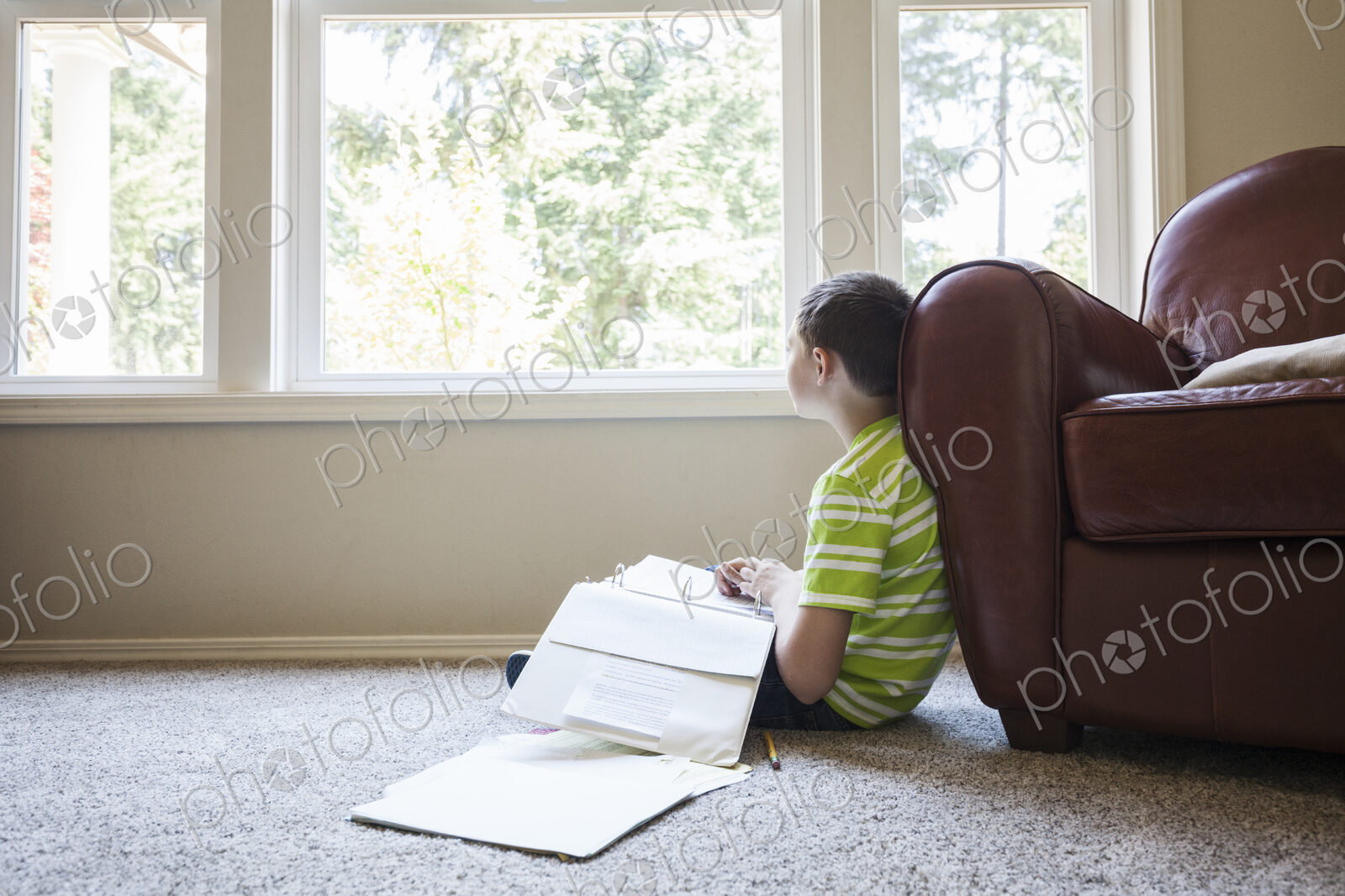 Young boy at home doing homework.