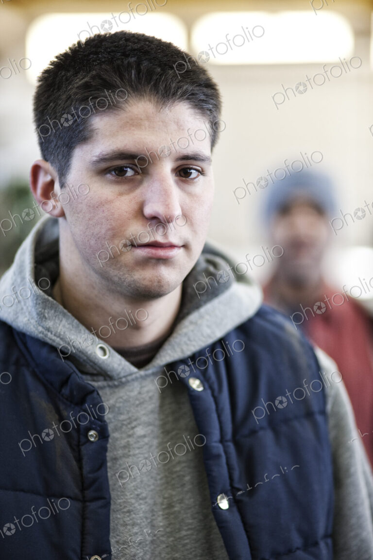 Young caucasian man factory worker in a sheet metal factory.