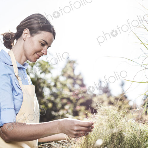 Young caucasian woman employee of a garden center nursery.