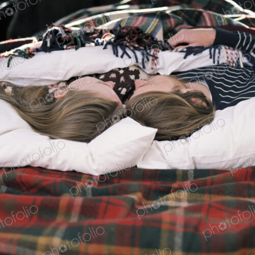 Young couple sleeping in the back of their car. Young couple sleeping in the back of their car.